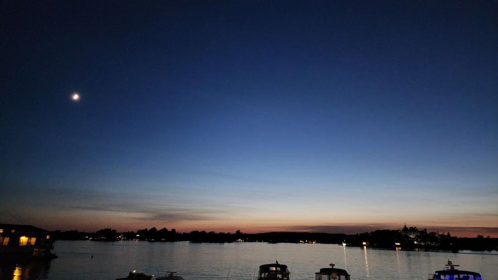 Dusk over the St Lawrence with Bolt Castle and the moon visible 