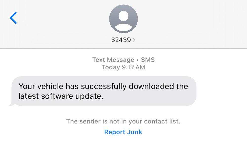 A text message stating, "Your vehicle has successfully downloaded the latest software update."