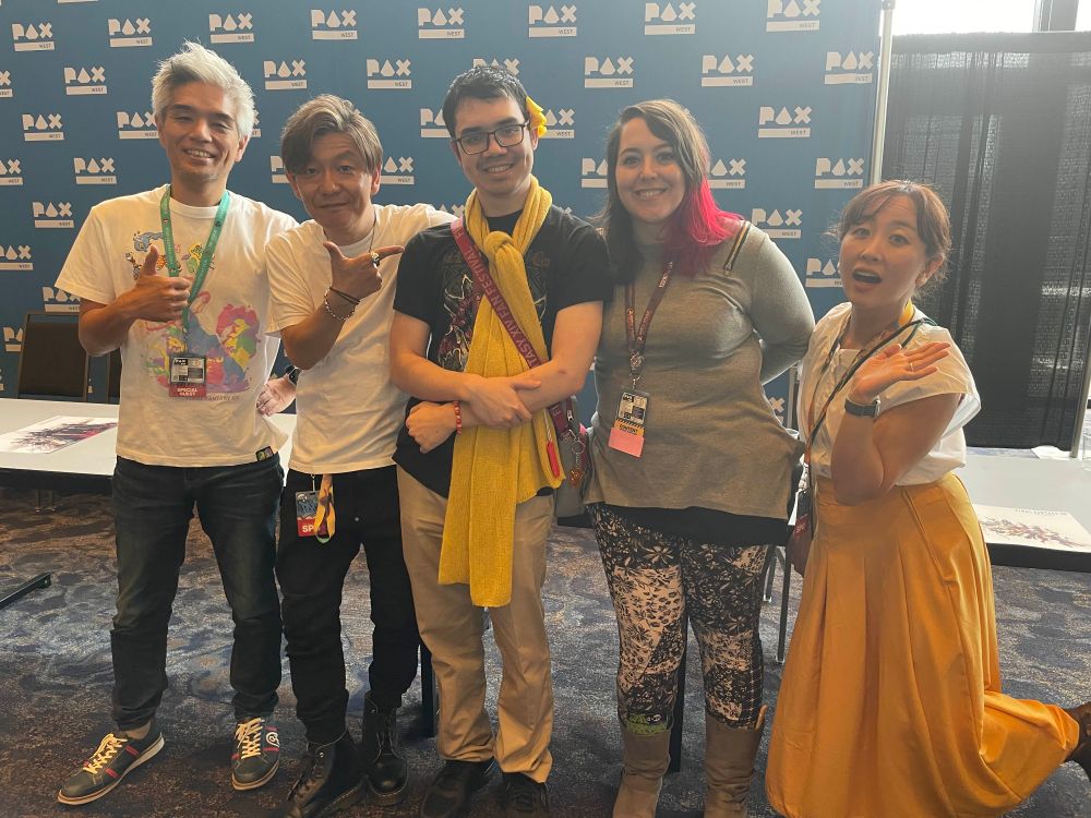 Jo and Echo standing beside FFXIV Producer/director Naoki Yoshida, translator/interpreter Aimi Tokutake, and Toshio Murouchi aka Foxclon