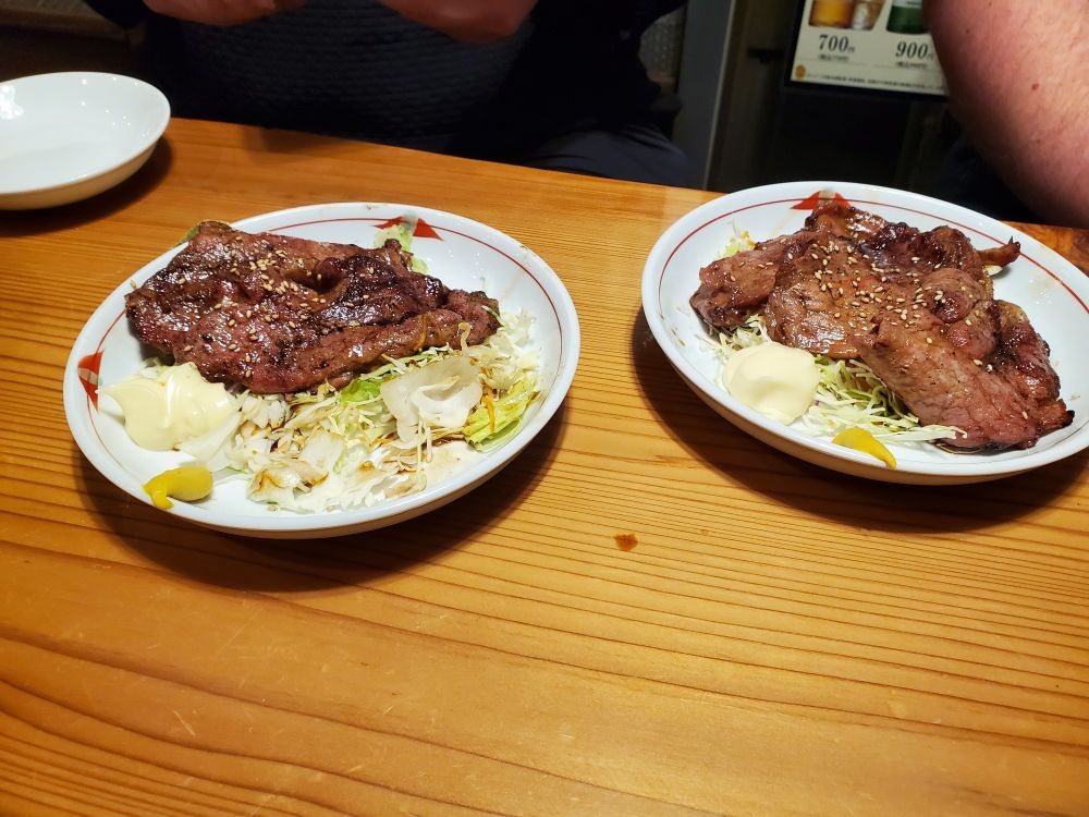 Some fried pork on lettuce with mayo on the side