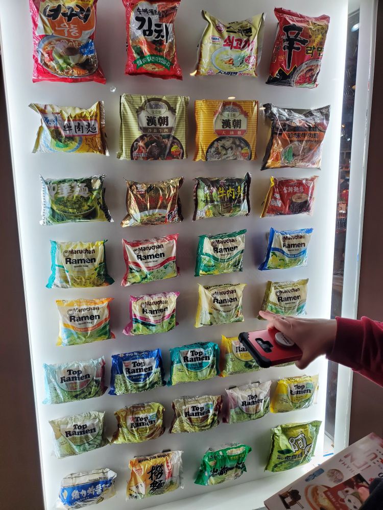 various packets of ramen through the decades in a display