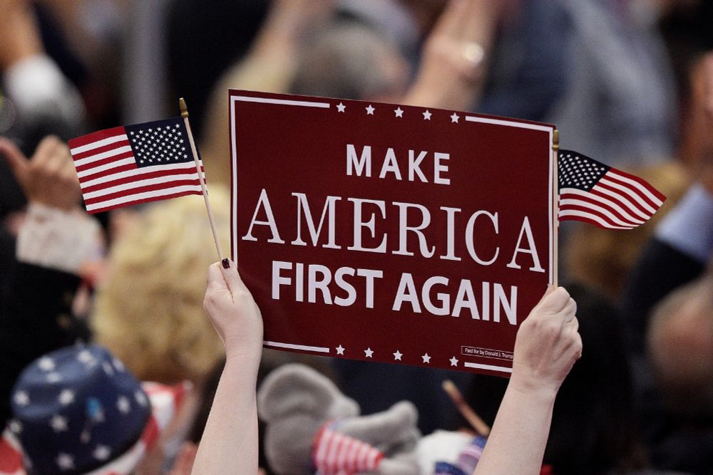 Make America First Again sign held up at a trump rally
