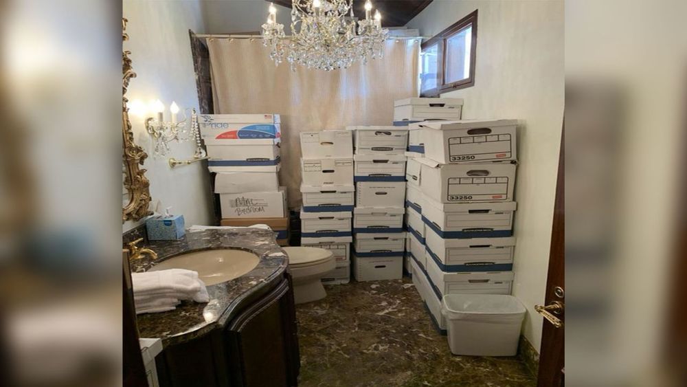 Cardboard boxes full of stolen government documents piled up in a Mar-A-Lago bathroom