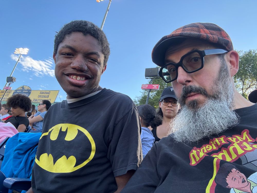 Me and Benjamin sitting in the stands at the trenton thunder game. 