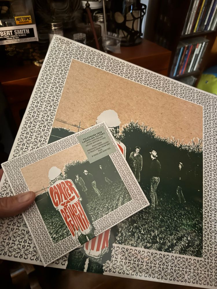 A copy of Camper Van Beethoven’s Telephone Free Landside Victory in Vinyl and CD
