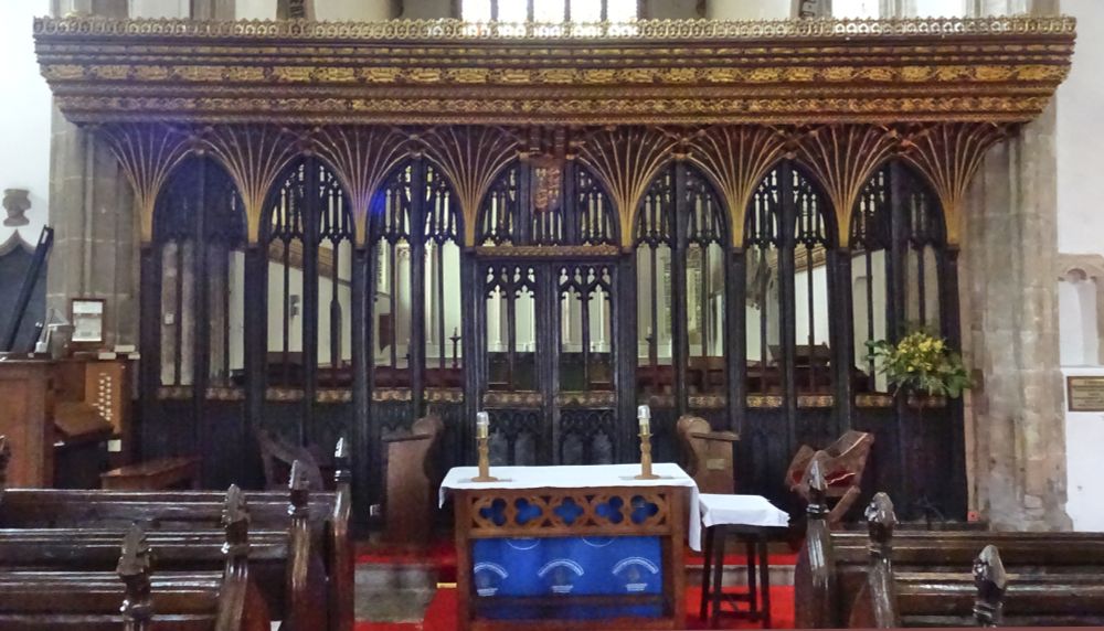 An extraordinary rood screen, with a carved wooden 'lid'.
