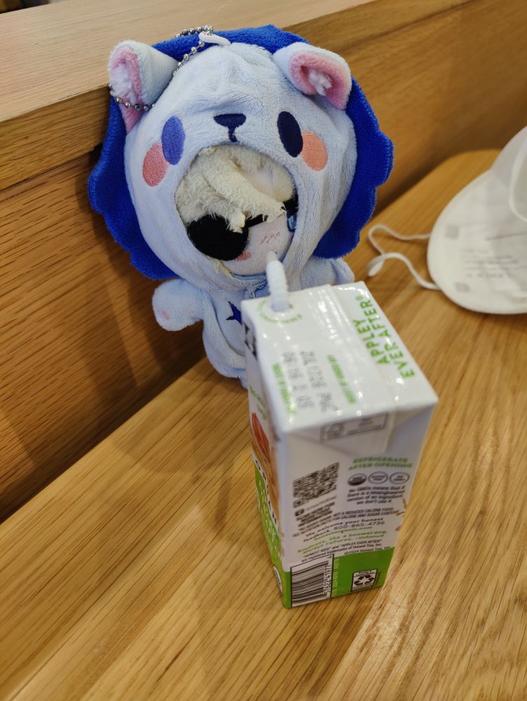 My Dimitri plushie drinking the shitty apple juice from the box.