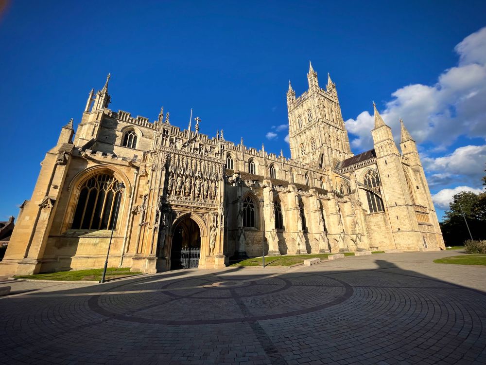 Gloucester Cathedral illuminated by late afternoon sun 