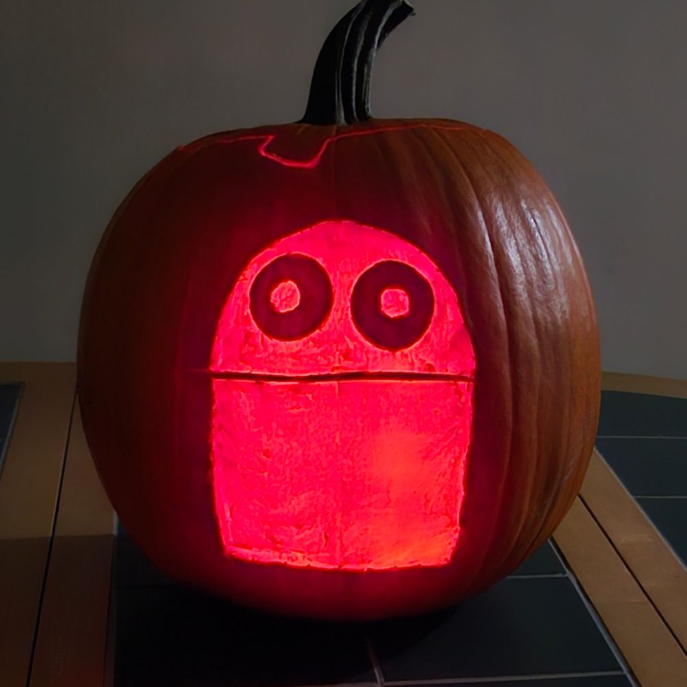 repo semibot carved into pumpkin