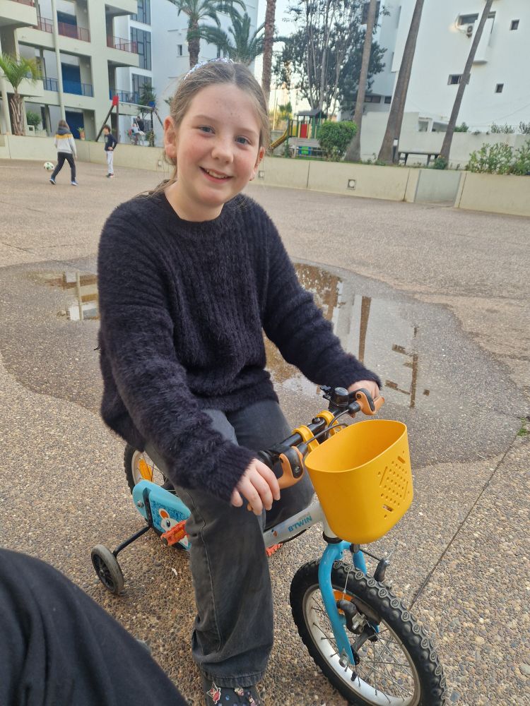 Girl on a tiny bicycle