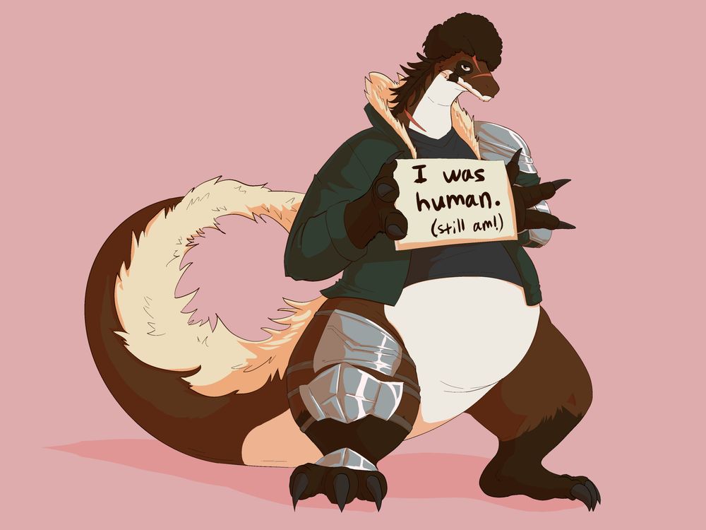 A furred dragon, wearing a forest-green coat and partial armor on his left arm and right leg, holds up a sign. The sign says, "I was human. In parentheses, still am."