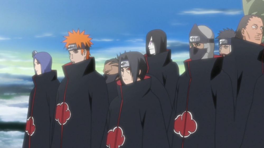 The members of the Akatsuki from Naruto lined up similarly in black cloaks with red clouds, reminisicent of the poppies