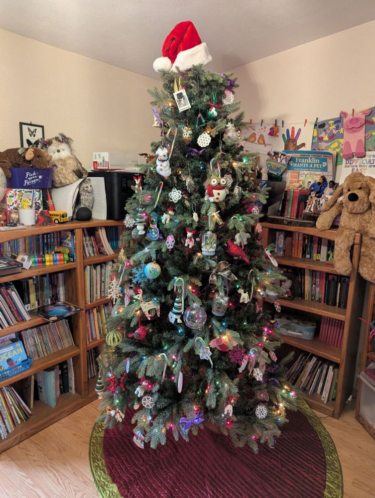 Christmas tree with a Santa hat topper