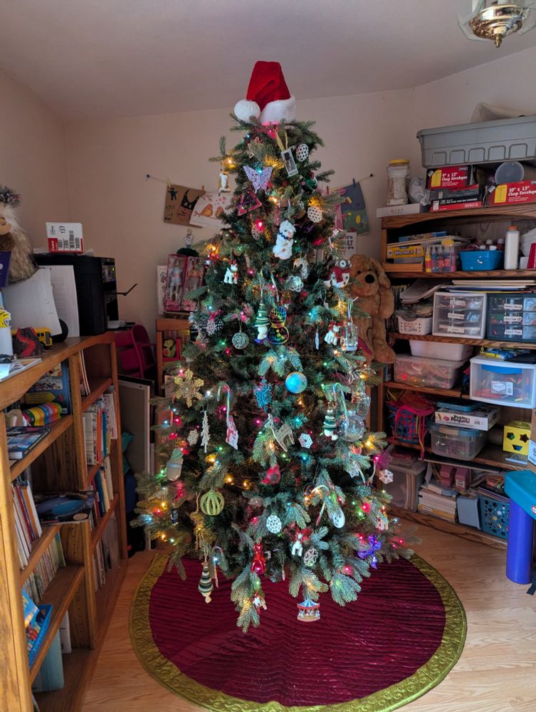 Christmas tree with a Santa hat topper
