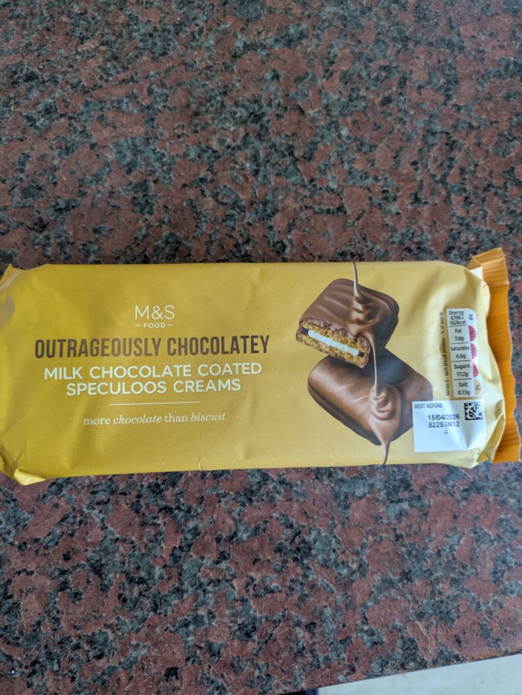 The new M&S extremely Chocolatey Milk Chocolate Speculoos creams in a green packet. 