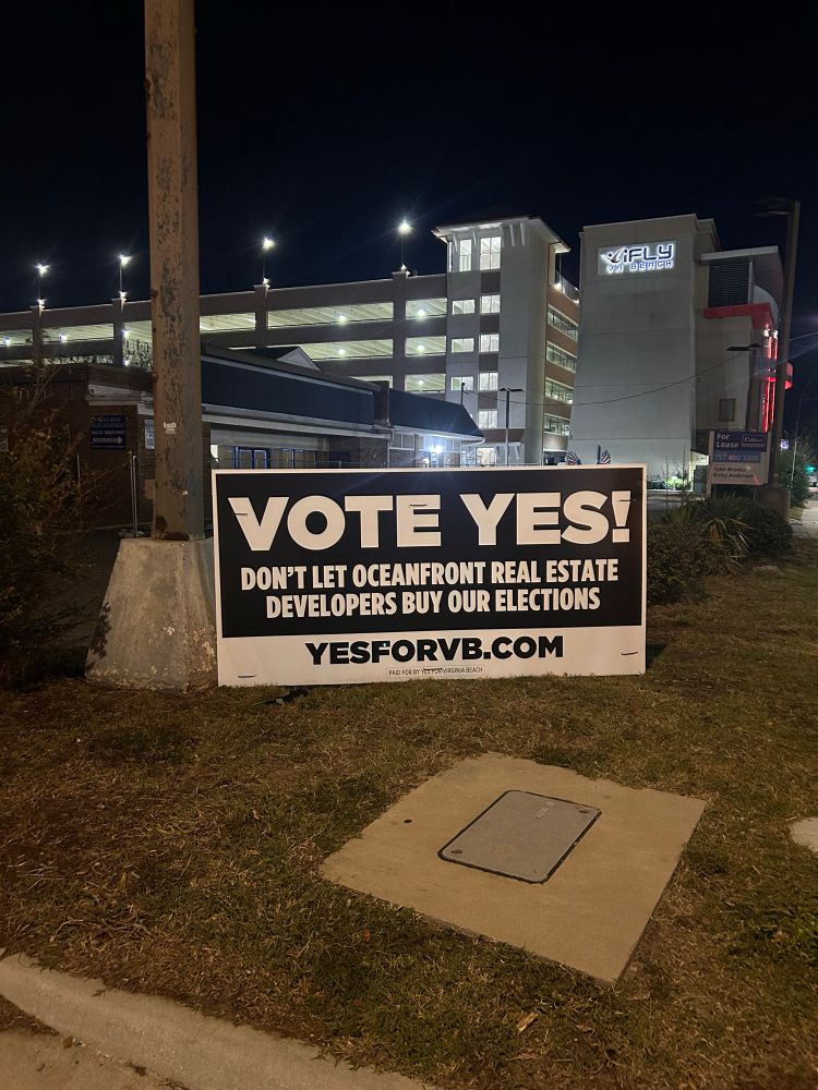 A “YES on 10-1” sign on Saturday night on 24th and Pacific.