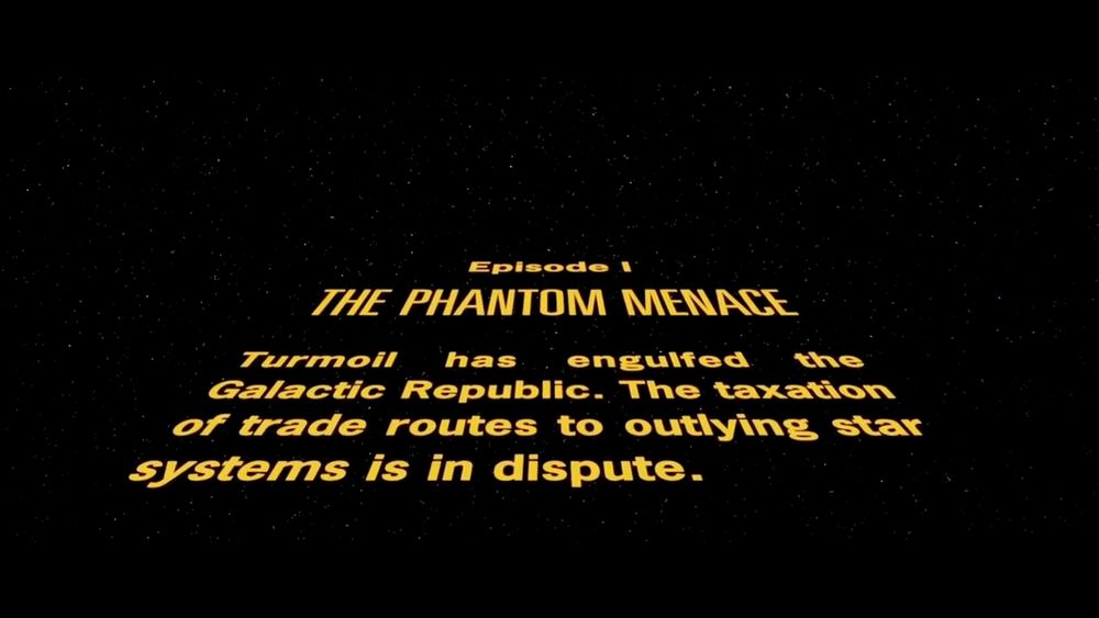 Screen shot of the opening scroll from Star Wars: The Phantom Menace that reads: "Turmoil has engulfed the Galactic Republic. The taxation of trade routes to outlying star systems is in dispute."