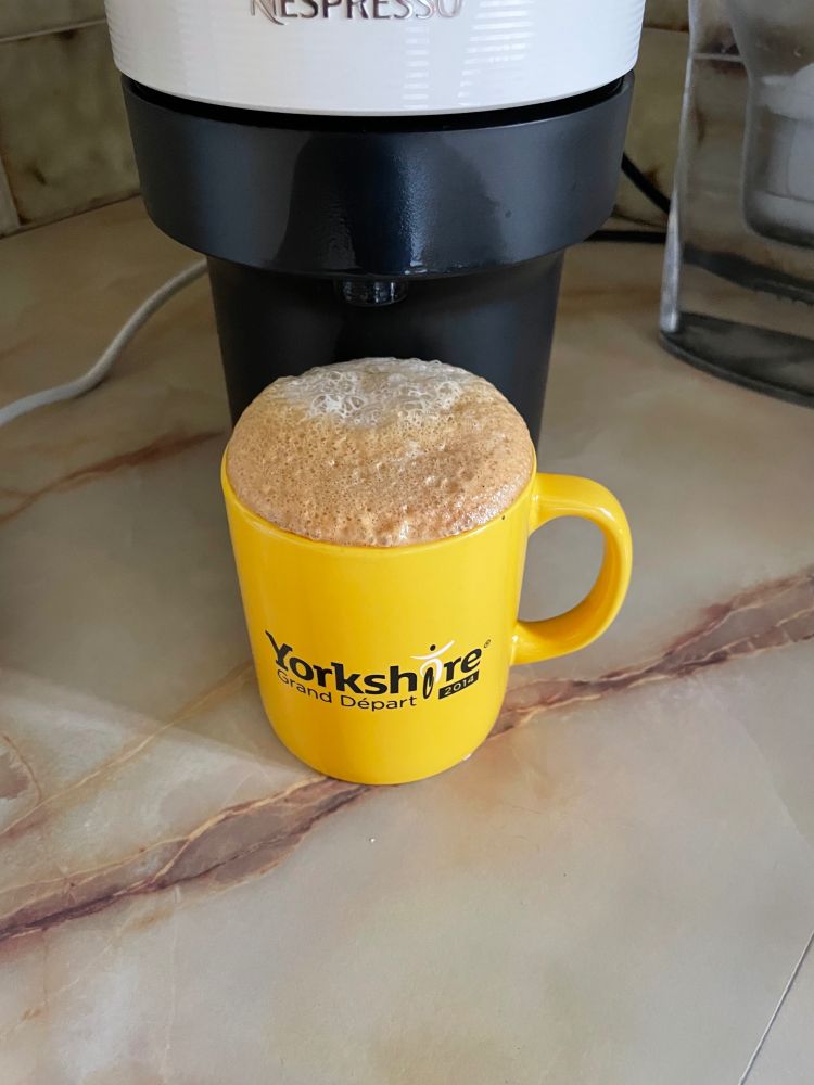 Tour de Yorkshire coffee mug overflowing with froth earlier. 