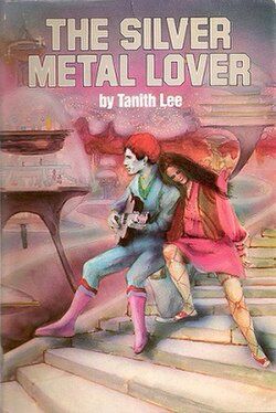 EXTREMELY 1970s looking water color painting cover of the Science Fiction Book Club edition of Tanith Lee’s The Silver Metal Lover (1981), featuring a a silver skinned android sitting on a stone staircase. He has short curly bright red hair, is wearing a blue body suit with a green accented v-neck and pink mid calf boots with purple and orange accents, and is playing what looks like a guitar. Leaning her head on the android’s shoulder is a light-skinned woman with long straight brown hair wearing a brown and red vest over a pink mini dress with balloon sleeves and gladiator sandals laced all the way up her legs. In the background are Jetsons-esque glass bubble structures against a pink and silver sky. 