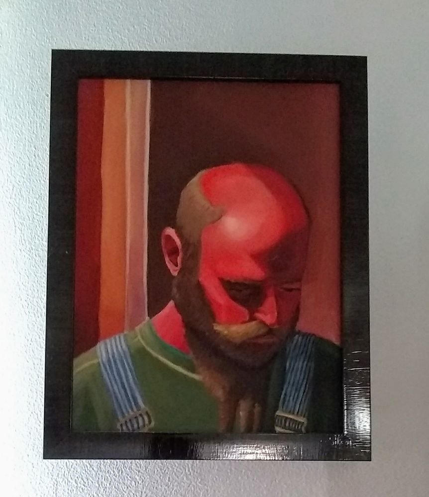 An oil painting of a man facing downward. His skin is painted in reds and he is wearing a green shirt with overalls.