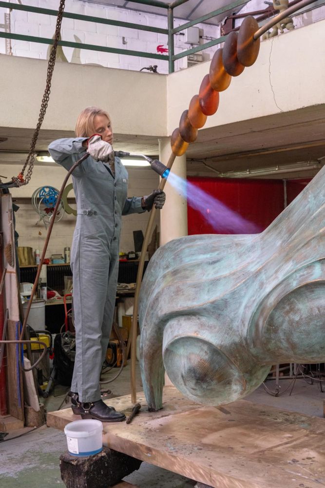 The artist Camille Henrot torch firing a very large bronze sculpture. Image courtesy Hauser & Wirth: https://www.hauserwirth.com/hauser-wirth-exhibitions/camille-henrot-a-number-of-things
