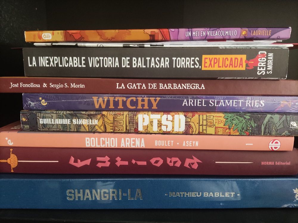 Una pila de cómics y libros lo bastante cara y gorda para marearme al mirarla. La mitad es ciencia ficción de autores europeos, la otra mitad mandanga de Morán y Laurielle.