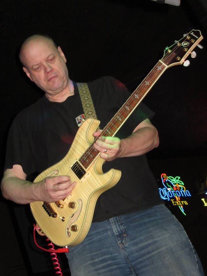 Me playing my Ibanez Artcore Custom model AWD102NT. It has a semi-hollowbody construction, two humbuckers, a micro-adjust bridge, and gold hardware. It was made in 2006. I bought it still new in 2008.