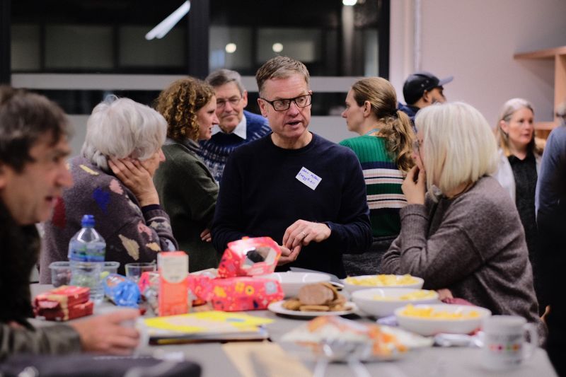A Fuelling Greater Manchester event attended by people talking to each other about community energy. 