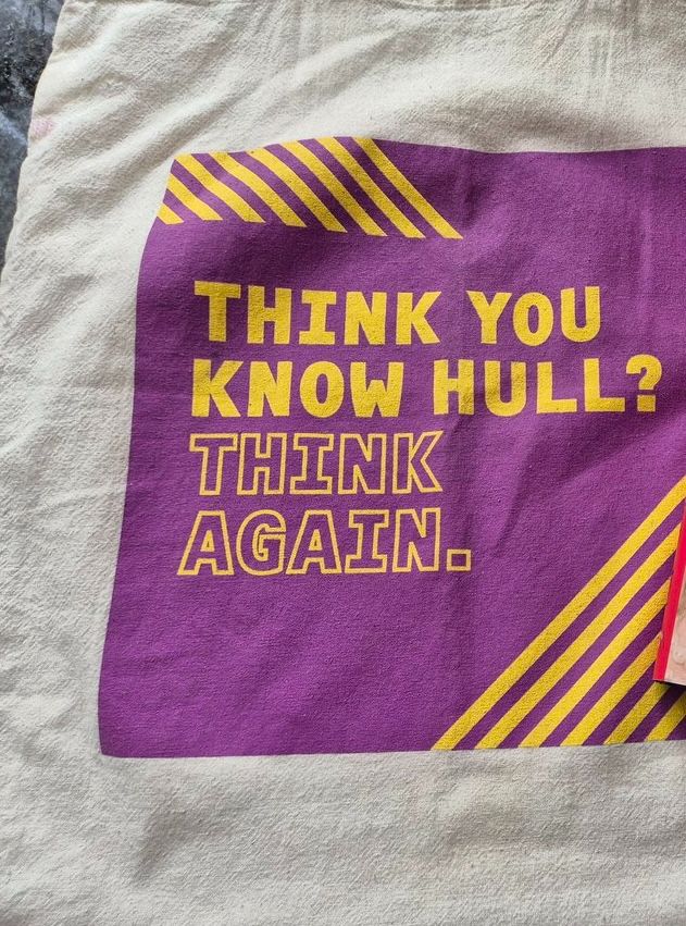 A tote bag with the words 'Think You Know Hull? Think Again' on it.