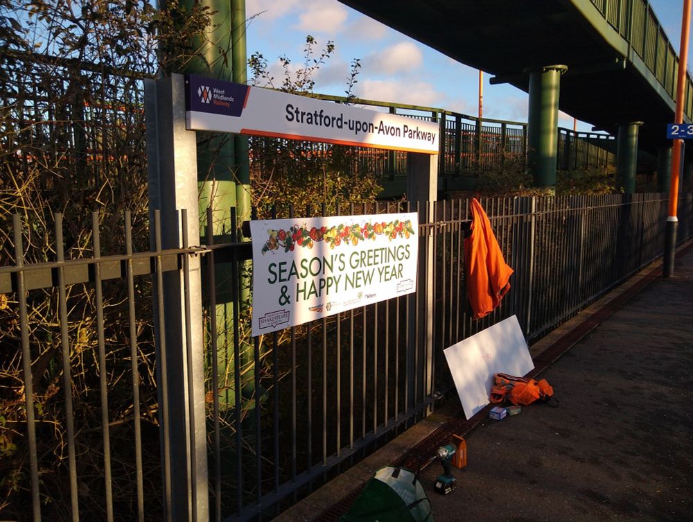 The Christmas banner under the Stratford-upon-Avon Parkway running in board on platform 1