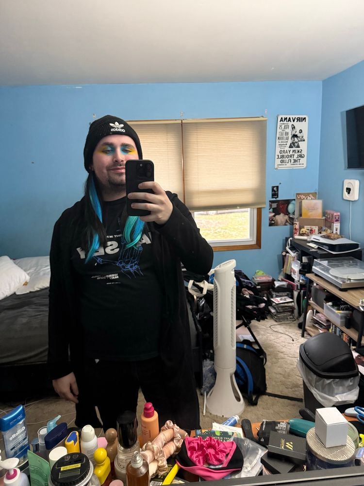 From the top:
I have a beanie on with blue and teal hair extensions and wearing blue and yellow eyeshadow 
We move on to the torso:
I have on a Halsey shirt and and a long black cardigan 