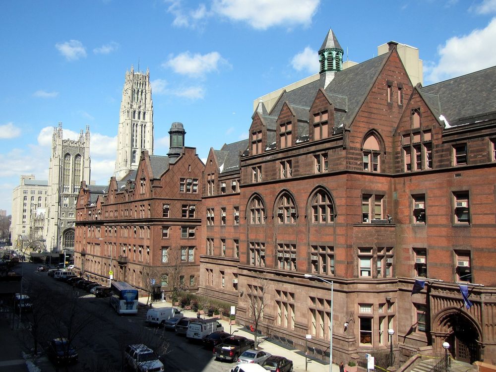 Brownstone buildings at Teachers College looking west toward Riverside Church. 
Creative Commons photo by Bohao Zhao