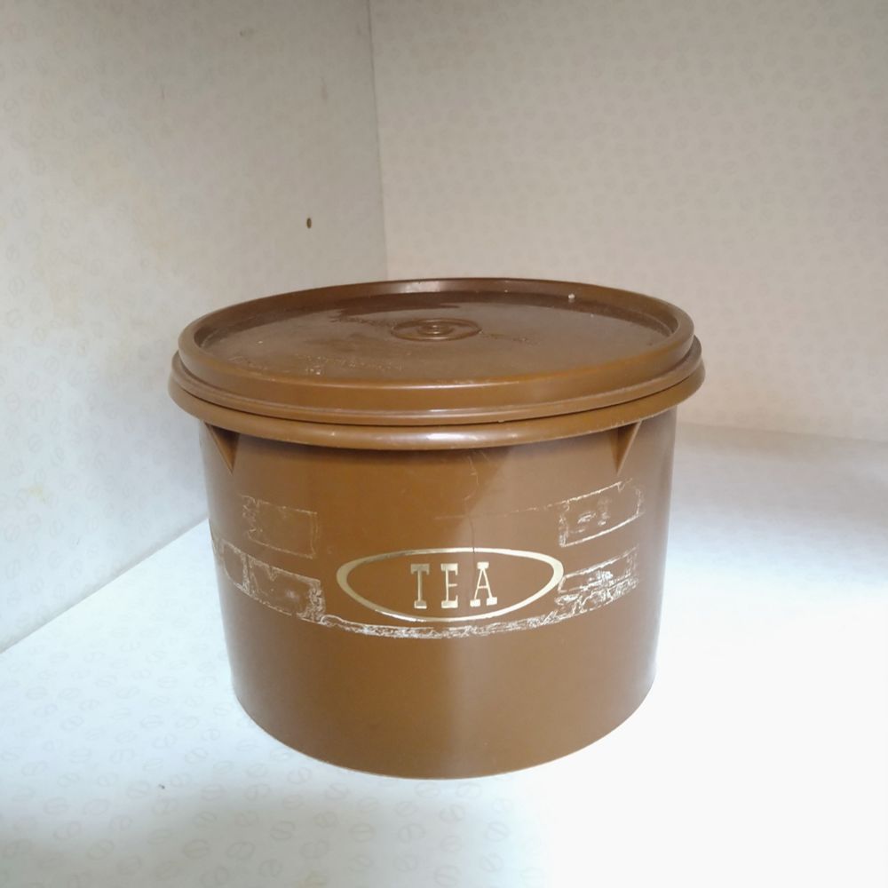 Brown Tupperware container labelled tea