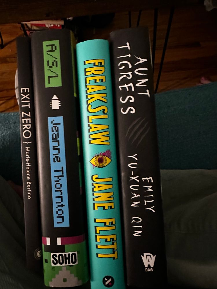 An image of four book spines. From left to right: Exit Zero by Marie-Helene Bertino, ASL by Jeanne Thornton, Freakslaw by Jane Flett, and Aunt Tigress by Emily Yu-Xuan Qin. 
