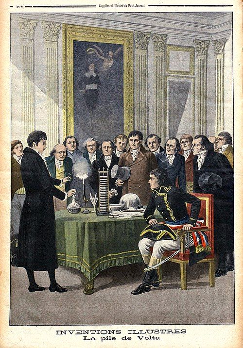Italian physicist Alessandro Volta (1745-1827), demonstrating his pile (battery) to Napoleon in Paris, 1801. From Le Petit Journal 1901.

https://commons.wikimedia.org/wiki/File:La_pile_de_Volta_(Le_Petit_journal).jpg