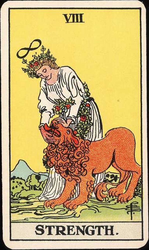 The Strength tarot card by Colman-Smith shows a figure dressed in a white robe with roses petting a lion.