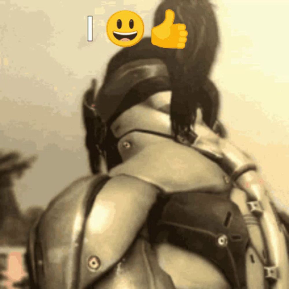 a person in armor giving a thumbs up with a smiley face behind them