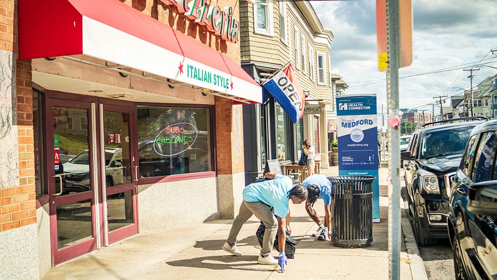 Two Tufts volunteers picking up trash off of Boston Avenue in Medford in front of Pini's Pizzeria the third annual Tufts Day of Service on September 26, 2025.