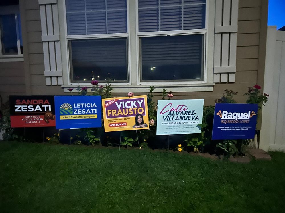 Washington State yard signs in a yard visited by UFW farm worker volunteers