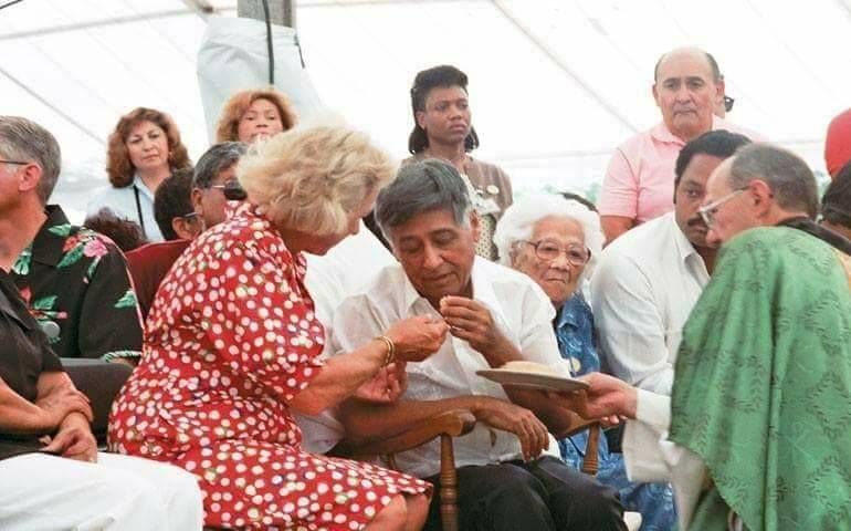 Cesar Chavez breaking his third fast by receiving communion from Ethel Kennedy. Photo by Victor Aleman