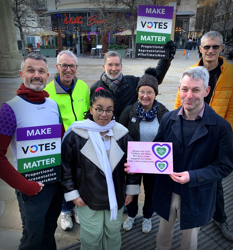 Will Forster MP standing with a group of MVM activists 
