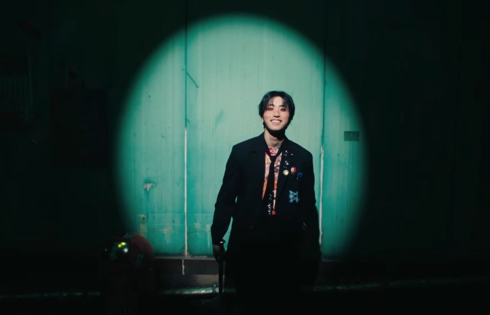 jisung smiling briefly but brightly in the hold my hand mv 