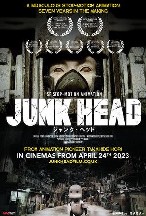 Poster for Junk Head. "A Miraculous Stop-Motion Animation Seven Years In The Making" SF Stop-Motion Animation Junk Head. From Animation Pioneer Takahide Hori. junkheadfilm.co.uk. A small white robot looks small in a giant futuristic city of junk.