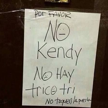 Sign poorly written in Spanglish: No kendy, no hay trico tri. No toquen la puerta”

Translation: no candy, there is no trick or treat. Do not knock on the door 