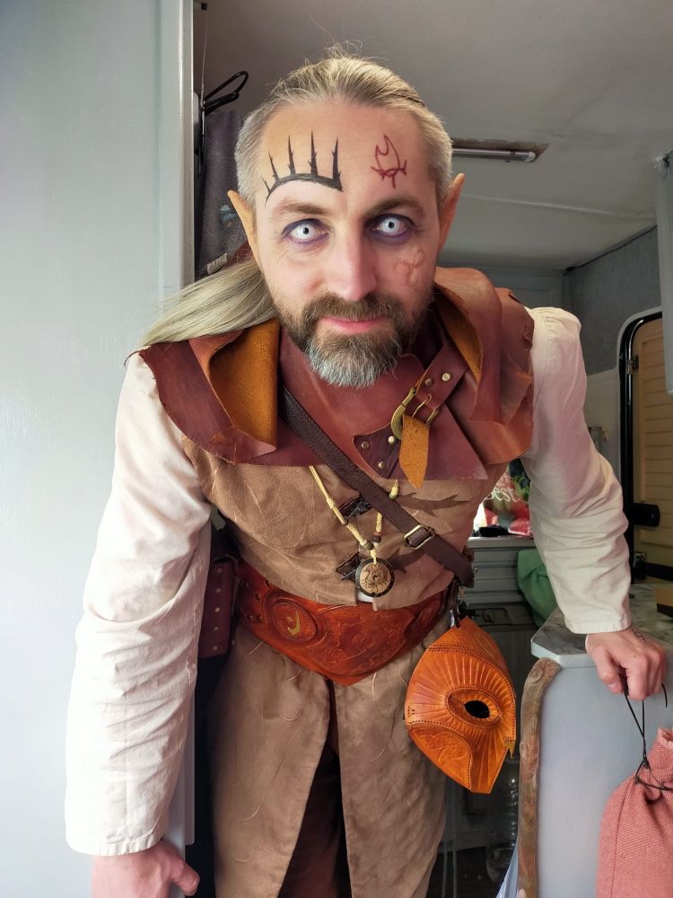 Chris dressed in LARP costume with white contacts and a beard.