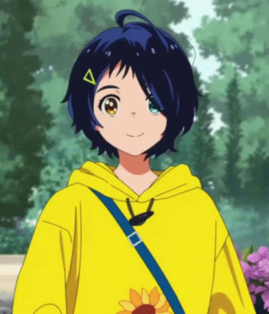 the girl is wearing a yellow hoodie with a blue strap around her shoulder