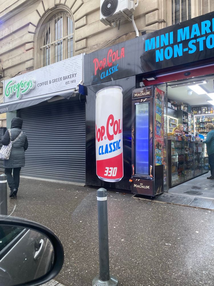 An advertisement reading “pop col classic 330”