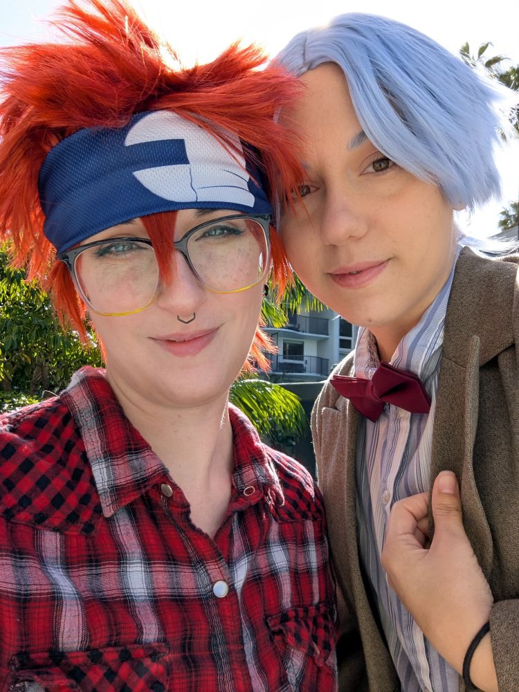Terra cosplaying as Reki from Sk8 the Infinity cross over with Amy Pond from Doctor Who. Adrian cosplaying as Langa from Sk8 the Infinity cross over with the Eleventh Doctor from Doctor Who.