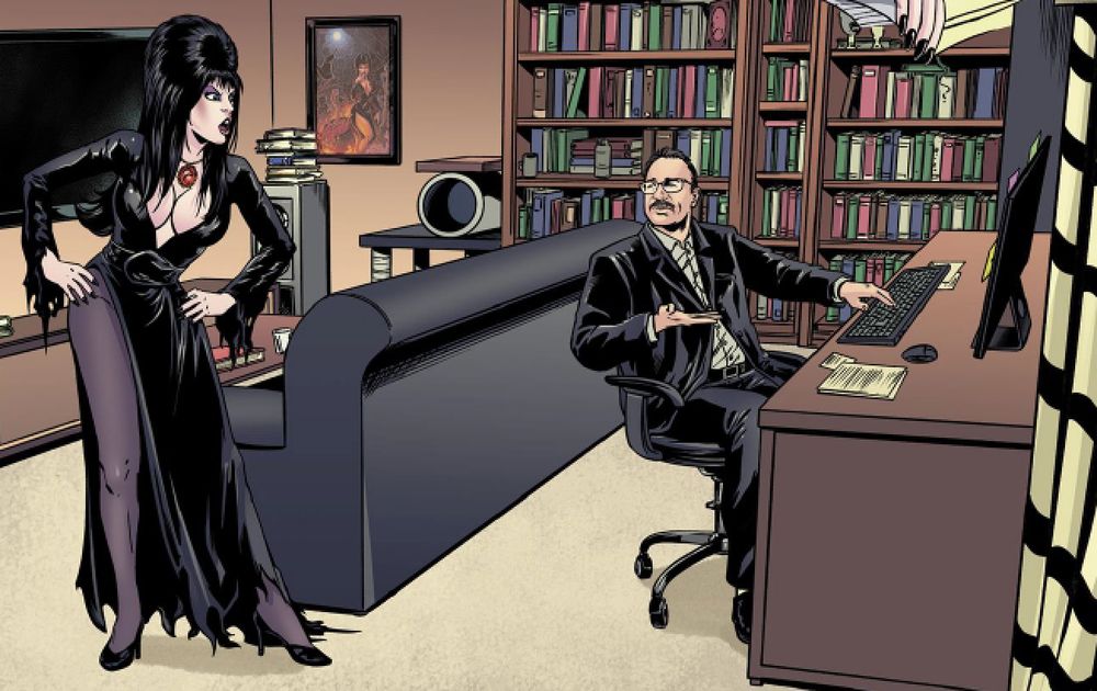 Elvira, hands on hips, berates writer David Avallone (seated) for being a hack. 