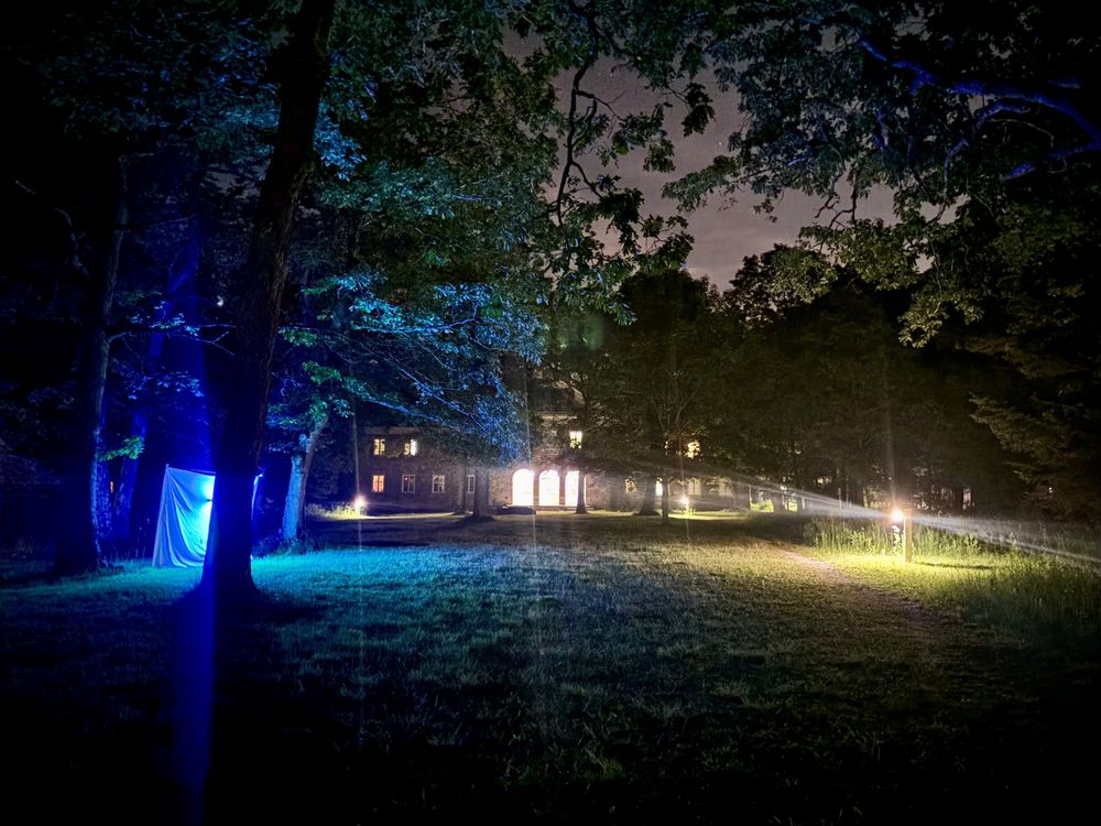 Ruth Patrick Hall at night with moth sheet in the foreground